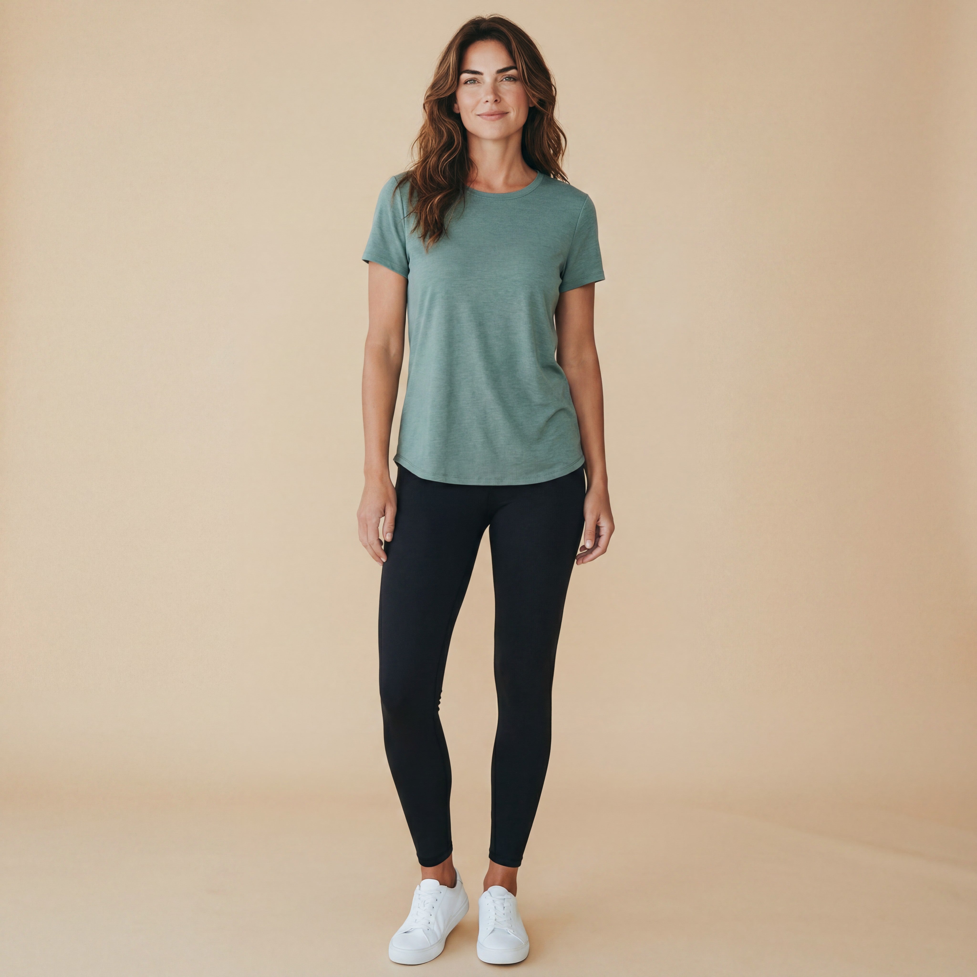 Women's back-cross cut-out tee, front view with crew neck and relaxed fit in sage green